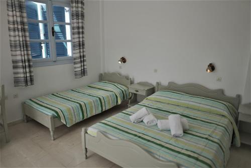Ein Bett oder Betten in einem Zimmer der Unterkunft Artemis Village