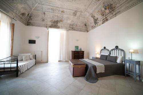 Una cama o camas en una habitación de Donna Elena