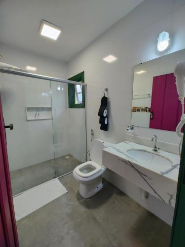 a bathroom with a sink and a toilet and a shower at Recanto Serra do Trovão in Ouro Preto