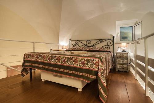 Cama o camas de una habitación en Appartamento dal Millenovecentotto