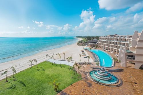 an aerial view of a hotel and the beach at Ramada Resort By Wyndham Dar es Salaam in Dar es Salaam