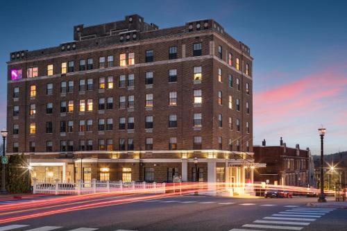 a large brick building with a street in front of it at Landmark Inn in Marquette