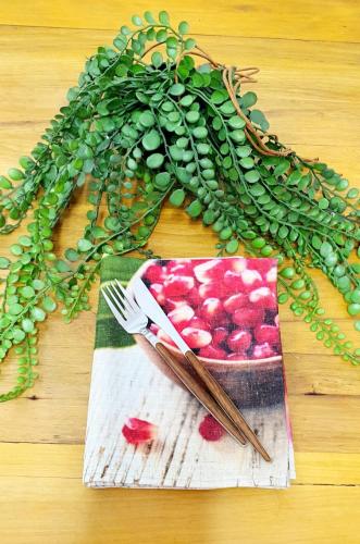 a table with a bowl of fruit and a bunch of plants at Kingfisher 20 in Velddrif