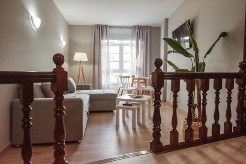 a living room with a couch and a table at LAR DA REVOLTA in Cedeira