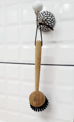 a wooden broom with a wooden stick on a wall at Kingfisher 20 in Velddrif