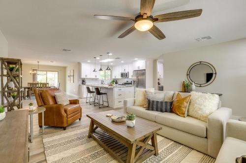 a living room with a couch and a ceiling fan at Near Peoria Sports Complex and Golf Home with Patio! in Sun City
