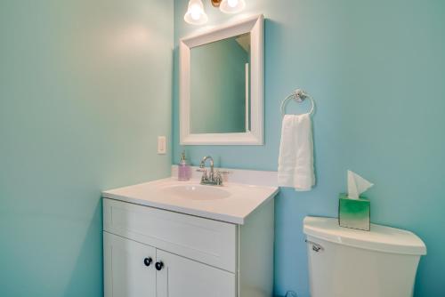 a bathroom with a sink and a toilet at Gorgeous Keansburg Home with Pool Walk to Beach! in Keansburg