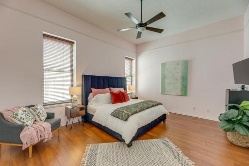 a bedroom with a bed and a ceiling fan at Renovated San Marcos Vacation Rental with Balcony! in San Marcos