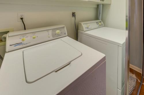 a white laundry room with a washer and dryer at Renovated San Marcos Vacation Rental with Balcony! in San Marcos
