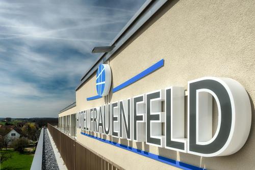 a sign on the side of a building at Hotel Frauenfeld in Frauenfeld