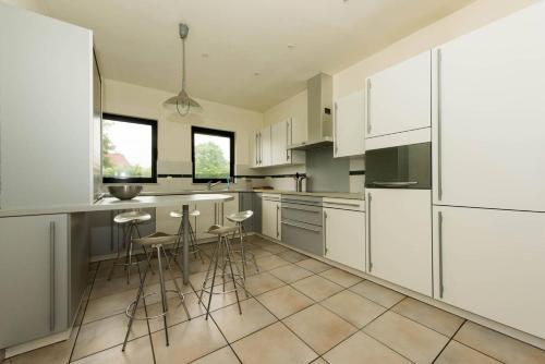 A kitchen or kitchenette at Vakantiehuis Villa 1 - 11 beds, 17p, 2 Bath-, 1 Livingroom