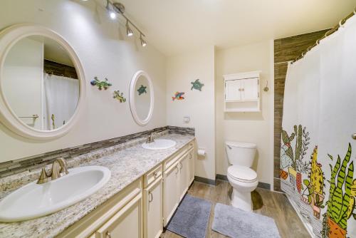 a bathroom with two sinks and a toilet at Vancouver Vacation Rental about 16 Mi to Portland! in Vancouver