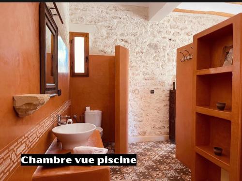 a bathroom with a sink and a toilet in it at Villa des Hauts Mogador in Essaouira