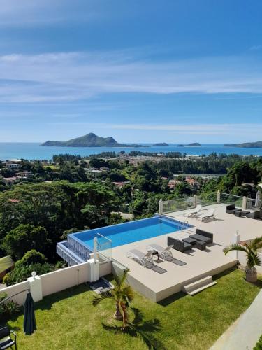 an aerial view of a villa with a swimming pool at Maison L'Horizon in De Quincey Village