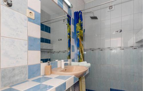 a bathroom with a sink and a mirror at 1 Bedroom Stunning Apartment In Komarna in Klek