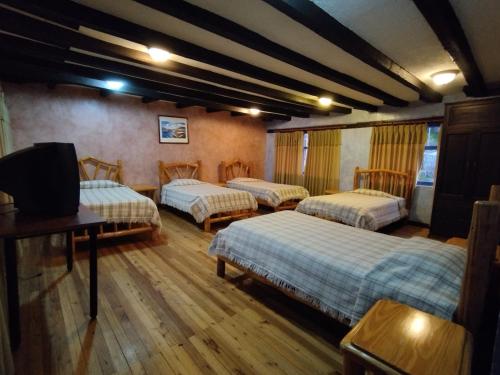 Postel nebo postele na pokoji v ubytování Hotel Achik Wasi