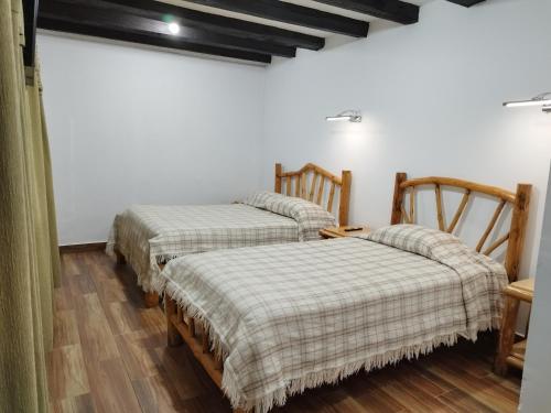 Postel nebo postele na pokoji v ubytování Hotel Achik Wasi