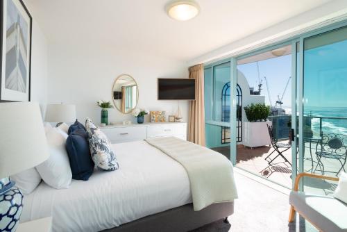 a bedroom with a bed and a view of the ocean at The Waterford on Main Beach in Gold Coast