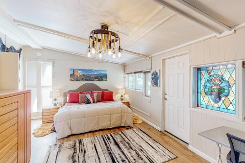 a bedroom with a bed and a stained glass window at Cowboy Cabin Ranch in Colorado Springs