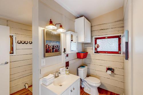 a bathroom with a sink and a toilet at Cowboy Cabin Ranch in Colorado Springs
