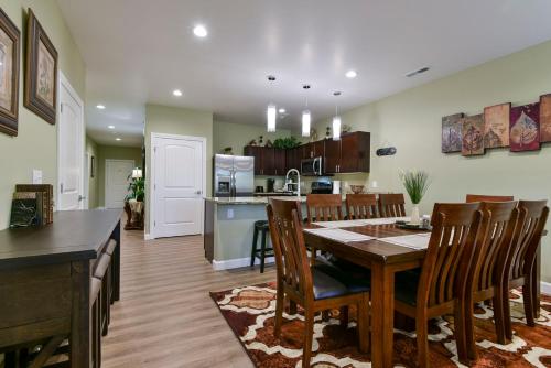 a kitchen and dining room with a table and chairs at Luxury Condos at Thousand Hills - Heart of Branson - Beautifully remodeled - Spacious and Affordable in Branson