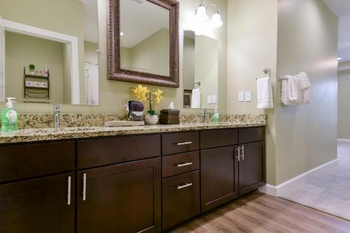 a bathroom with a sink and a mirror at Luxury Condos at Thousand Hills - Heart of Branson - Beautifully remodeled - Spacious and Affordable in Branson