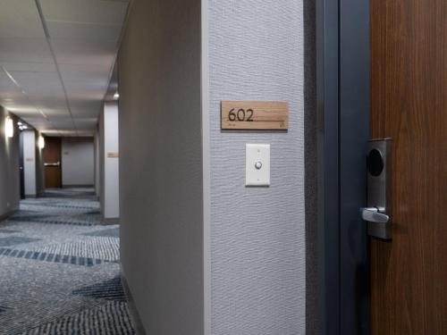 a sign on a wall in an office hallway at Staybridge Suites Chicago O'Hare - Rosemont by IHG in Rosemont