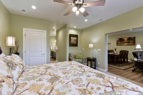 a bedroom with a bed and a ceiling fan at Luxury Condos at Thousand Hills - Heart of Branson - Beautifully remodeled - Spacious and Affordable in Branson