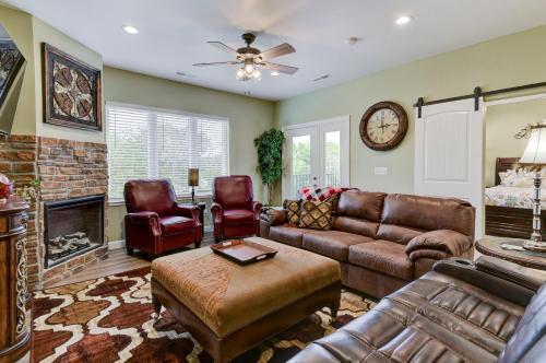 a living room with leather furniture and a fireplace at Luxury Condos at Thousand Hills - Heart of Branson - Beautifully remodeled - Spacious and Affordable in Branson