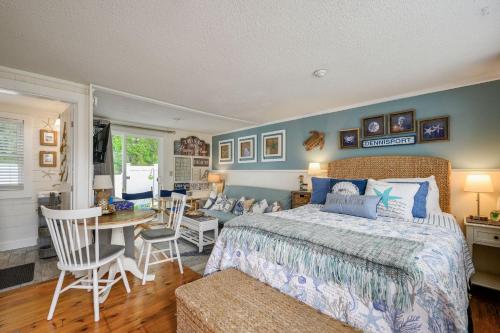 a bedroom with a bed and a table and chairs at 194 Captain Chase Road Dennis Port Cape Cod - - Beach Retreat I in Dennis Port