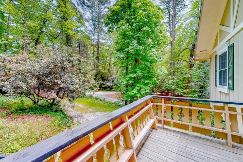 a balcony of a house with a wooden railing at Cobb House in Highlands