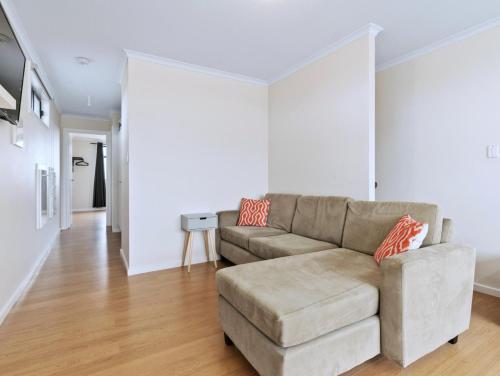a living room with a couch and a table at Blue Door Retreat in Edithburgh