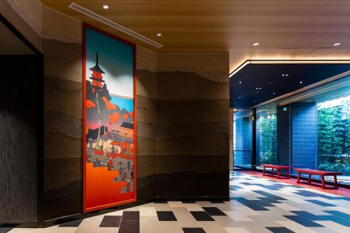 a lobby with a large painting on the wall at the b asakusa in Tokyo