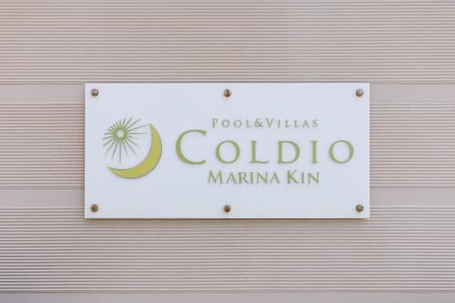 a sign for a colomboarmaarmaarmaarmaarmaarmaarmaarmaarmaarma at Coldio Marina Kin in Kin