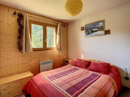 a bedroom with a bed and a window at Appartement Le Biot, 3 pièces, 4 personnes - FR-1-573-115 in Le Biot