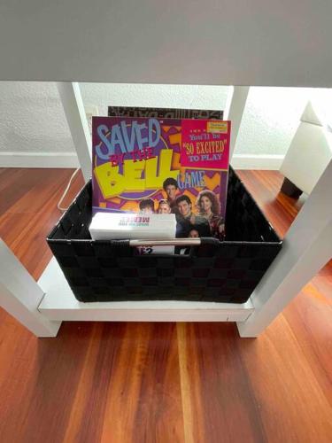a basket filled with magazines on top of a floor at Lovely Home 30MIN to Berkeley, SF, Napa in Pinole