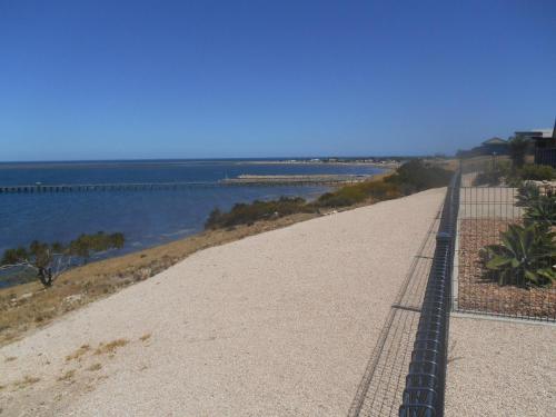 a view of the ocean from the top of a beach at Sea La Vu in Stansbury