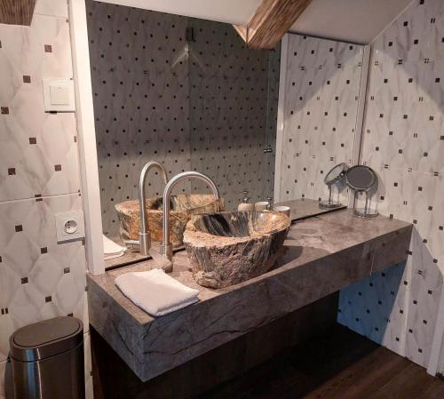 a bathroom with two sinks and two mirrors at Quiet place in Kaunas