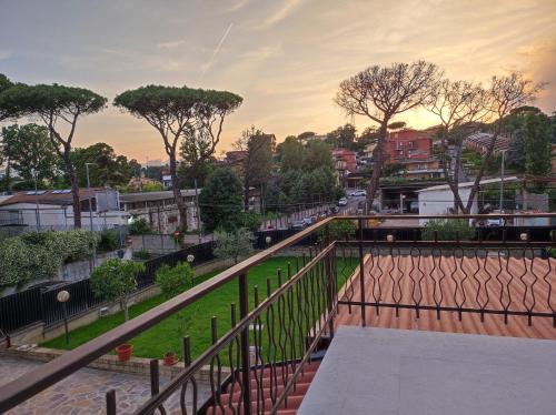 a view from a balcony of a street with trees at Belvedere Rooms Guest House in Rome
