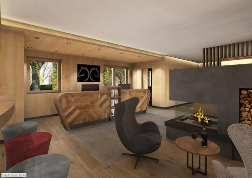 a living room with a chair and a fireplace at Hotel Pozzamanigoni in Selva di Val Gardena