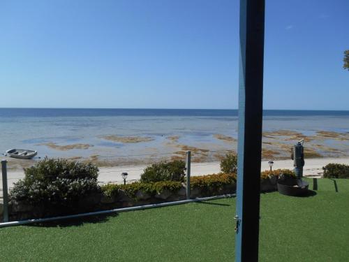 a view of the beach from the balcony of a resort at St Helens Beachfront - Absolute Beachfront in Edithburgh