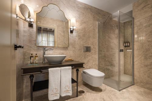 a bathroom with a sink and a toilet and a shower at Áurea Casa Palacio Sagasta by Eurostars Hotel Company in Cádiz