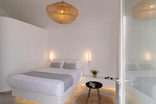 Un ou plusieurs lits dans un hébergement de l'établissement Maeva Suites Santorini