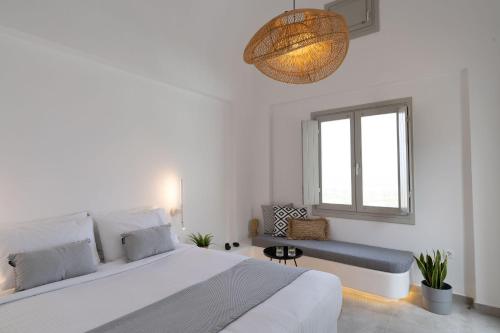 Un ou plusieurs lits dans un hébergement de l'établissement Maeva Suites Santorini