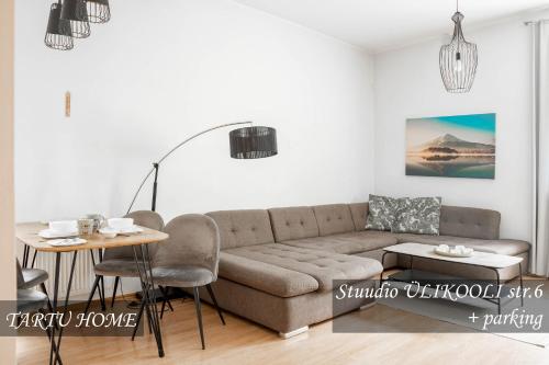 a living room with a couch and a table at University City Heart, Tartu Home in Tartu