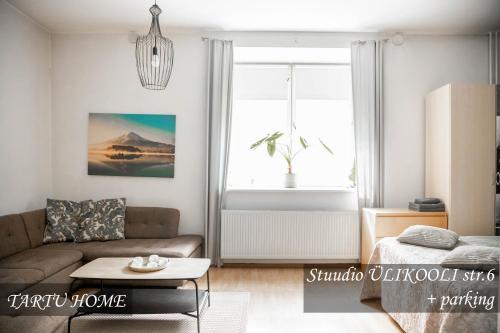 a living room with a couch and a table at University City Heart, Tartu Home in Tartu