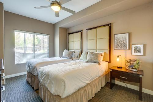 a bedroom with two beds and a window at Pet-Friendly Phoenix Condo with Community Amenities in Phoenix