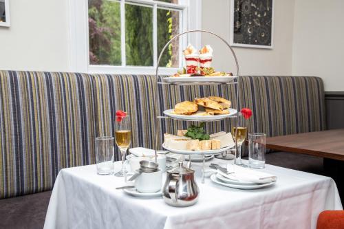 a table with a plate of food on top of it at Park House Hotel in Shifnal