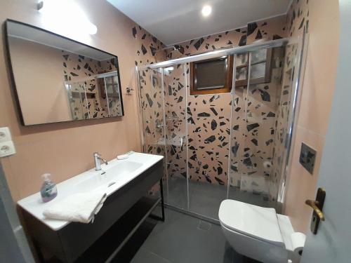 a bathroom with a sink and a shower at Villa Emily in Syvota