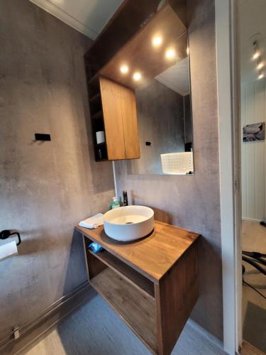 a bathroom with a sink and a mirror at Friends & Family Apartment at Hafjell Alpinlandsby/Øyer Center in Hafjell